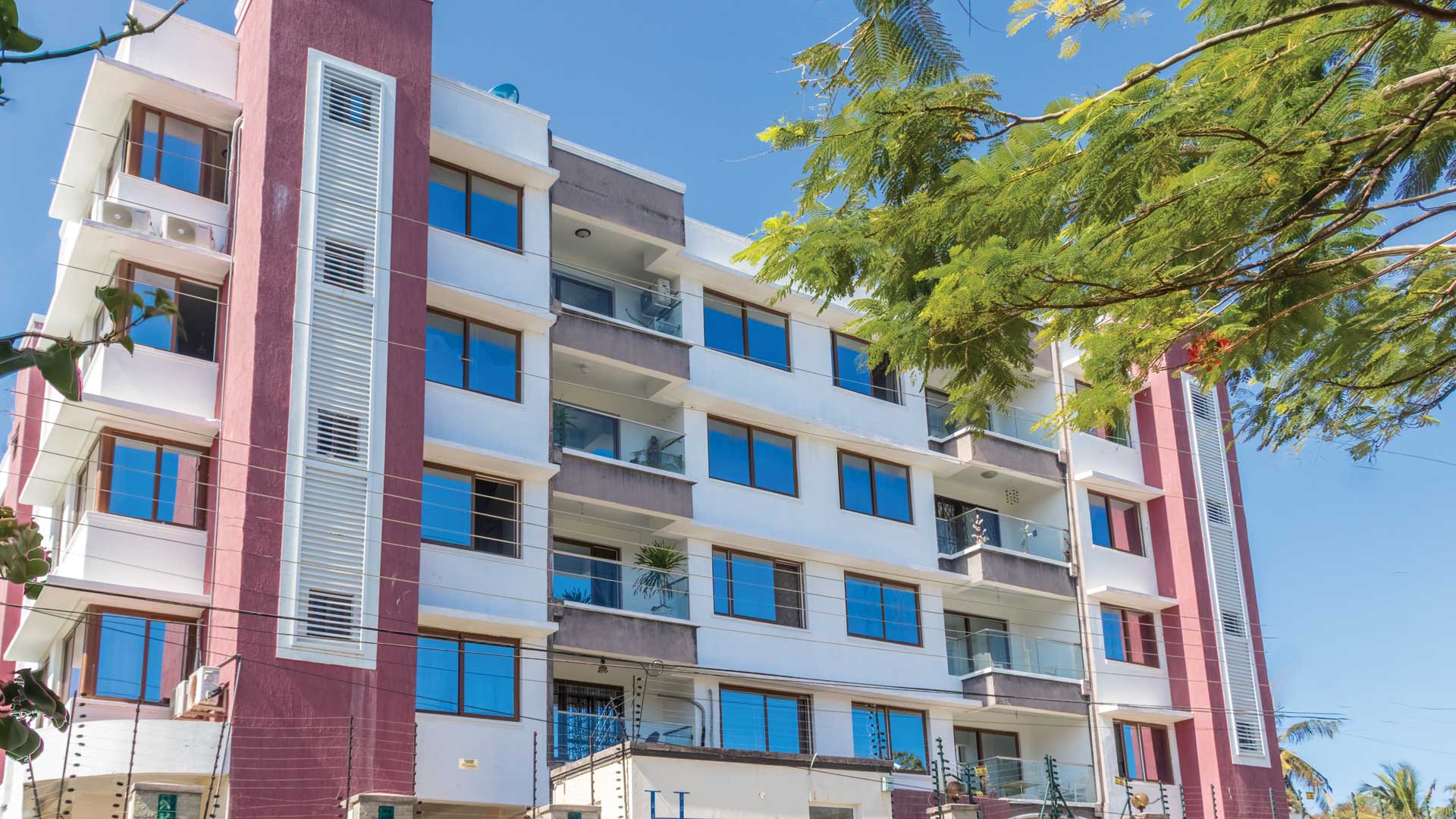 Mombasa apartment design with balconies, ventilation and parking podium